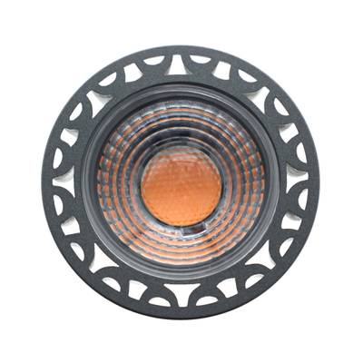 Silverfärgad LED-strålkastarlampa, mönstrad glaslins, riktad belysning, kallvitt ljus.