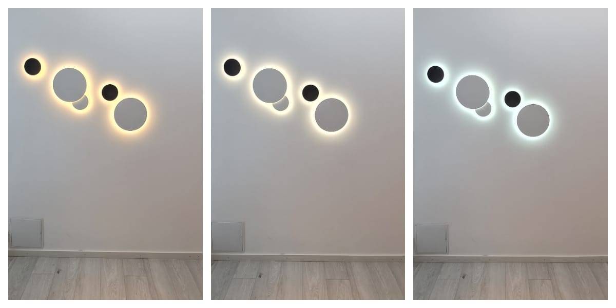 I nätbutiken LedS.fi finns flera serier LED-vägglampor som bildar cirkulära designelement i olika storlekar, perfekta för den vita väggen. Varje armatur skapar en egen ljusstämning: varmgul, mjukvit och ett svalare blåaktigt sken. Den omgivande väggen och golvet går i grå nyanser.