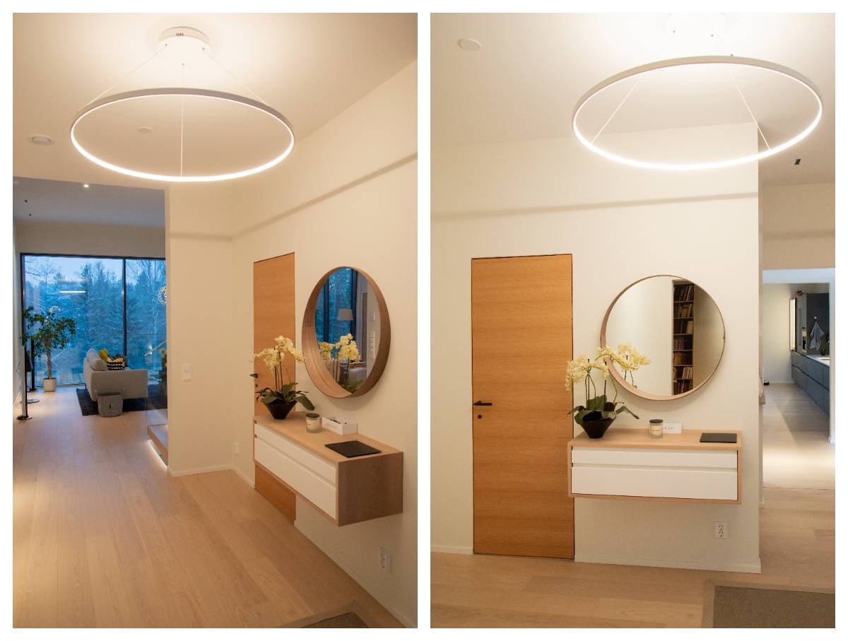Dekorativ taklampa i hallen. Vit ring med LED-remsa på den inre ringen. 