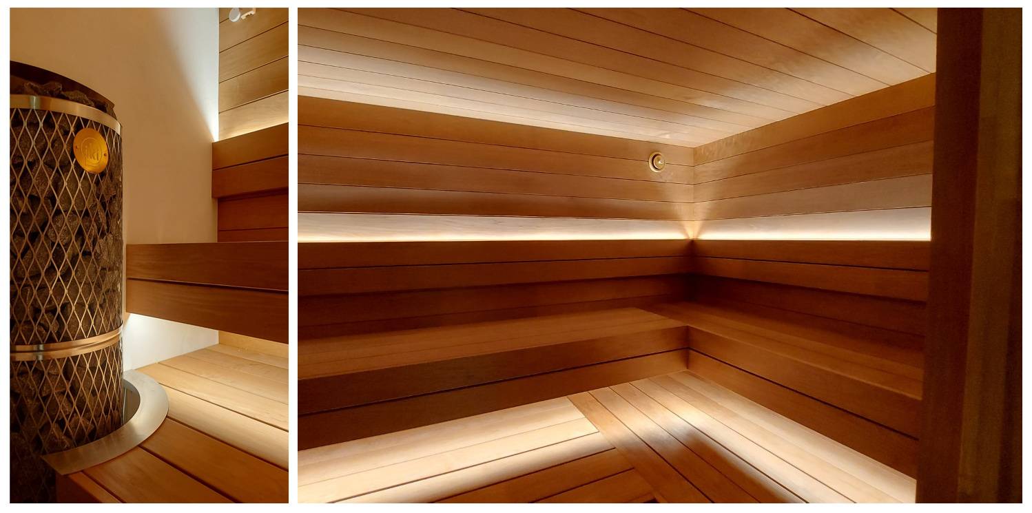 Bastu led strip belysning under taket och högst upp på ryggstödet. Foto.